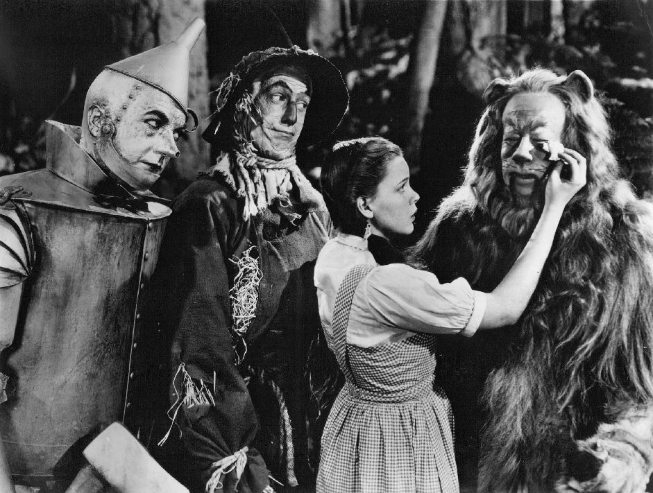 Jack Haley as the Tin Man, Ray Bolger as the Scarecrow, Judy Garland as Dorothy, and Bert Lahr as the Cowardly Lion in Wizard of Oz character publicity.