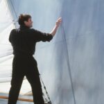 Jim Carrey as Truman Burbank touching the wall at the edge of his artificial world in The Truman Show (1998)